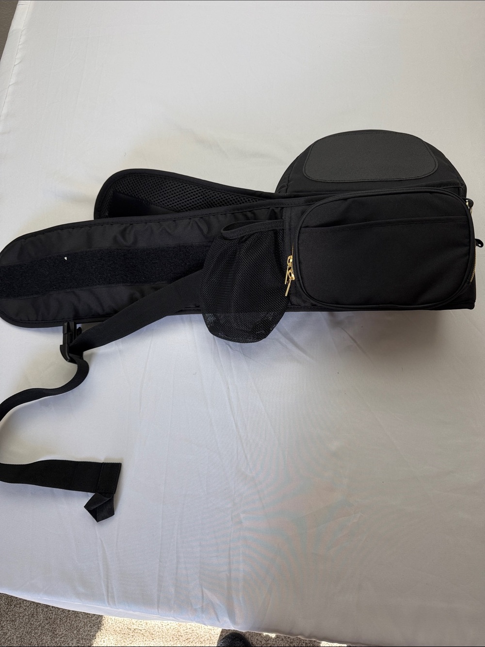 Tushbaby ergonomic hip carrier in black with gold hardware. Adjustable - Picture 5 of 9